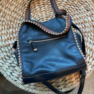 Big Buddha faux leather shoulder bag with gold ball accents.